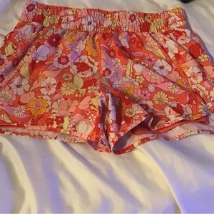 Avia Size 12-14 floral athletic shorts with orange floral with bike liner
